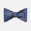 View 1 of product The Turnbull & Asser Brown and Blue Circle and Spot Silk Bow Tie features a blue silk base with light blue and brown circular dots on textured fabric, shown against a white background.