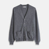 View 1 of product The Grey Fine Cashmere Cardigan by Turnbull & Asser is a long-sleeve, button-up sweater with two front pockets, shown on a white background.