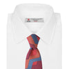 View 2 of product The Turnbull & Asser Red and Blue Zig Zag Silk Tie is a limited-run silk tie featuring interlocking geometric zigzag shapes and diagonal stripes in red, blue, gold, and navy.