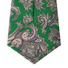 View 4 of product The Turnbull & Asser Green and Purple Large Paisley Printed Silk Tie features a light purple and white intricate paisley pattern, rolled up and set against a plain white background for timeless style.