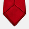 View 4 of product The Turnbull & Asser Red Horizontal Twill Silk Tie, rolled up, is ideal for adding a smart touch to cotton shirts.