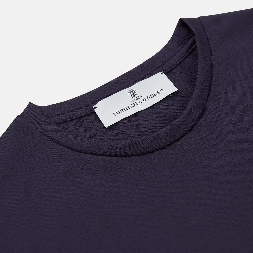 The Turnbull & Asser Navy Davey Cotton T-Shirt, made from fine-gauge jersey fabric, features short sleeves, a crew neck, and a small white tag with text inside the back collar, displayed flat on a white background.