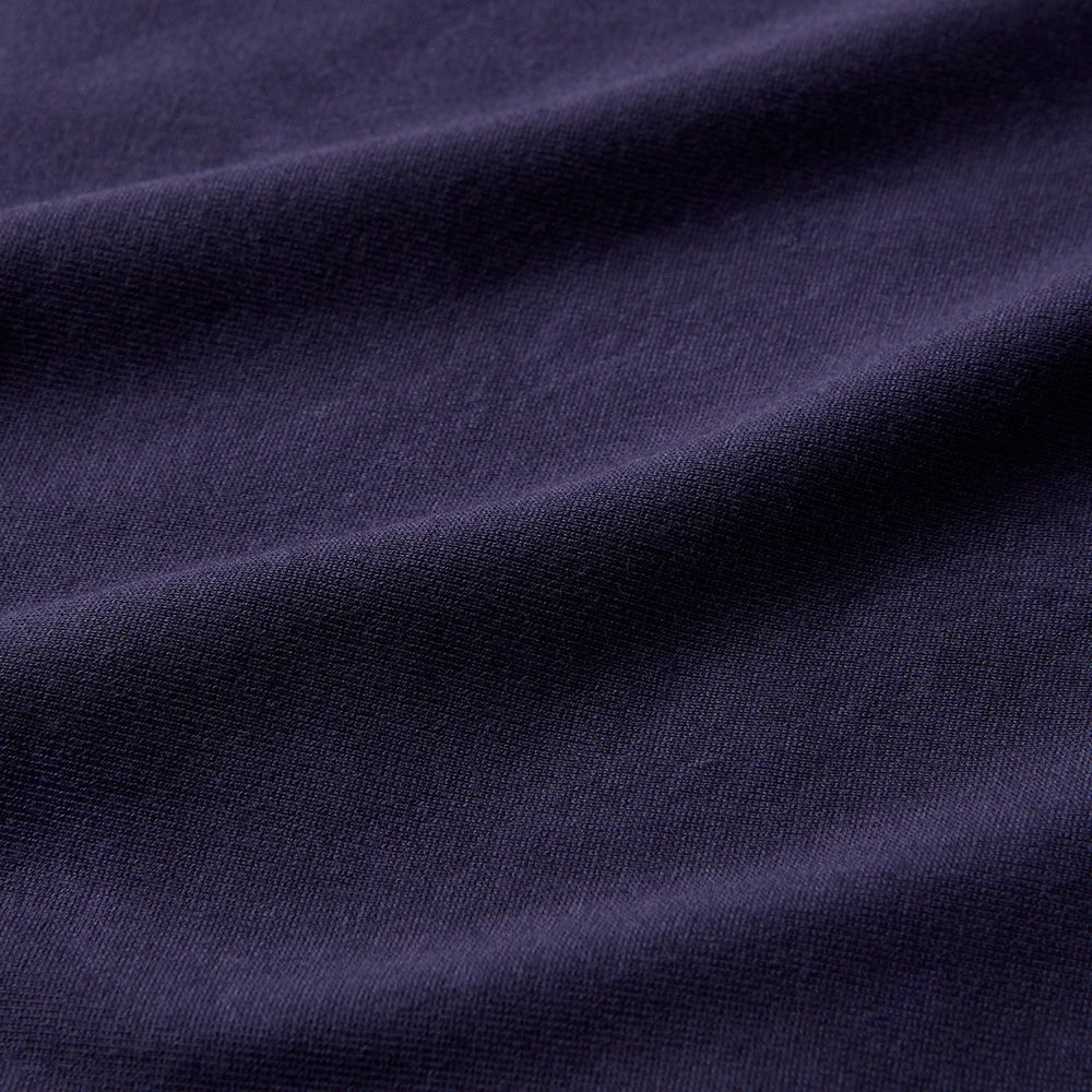 The Turnbull & Asser Navy Davey Cotton T-Shirt, made from fine-gauge jersey fabric, features short sleeves, a crew neck, and a small white tag with text inside the back collar, displayed flat on a white background.