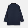View 7 of product The Turnbull & Asser Navy Dry-Waxed Cotton Field Jacket features a collar, front zipper with snap buttons, two chest pockets, and large hip flap pockets, shown laid flat on a plain white background.