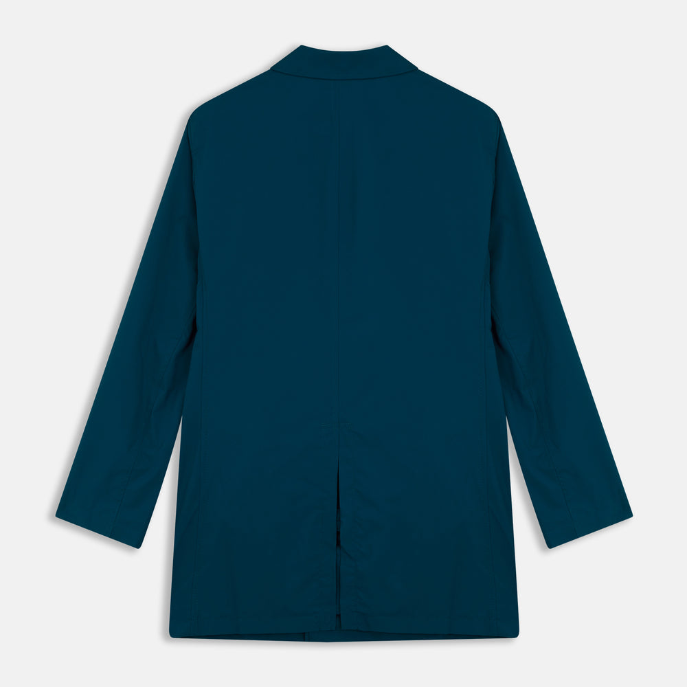 The Turnbull & Asser Blue Pack-Away Rain Mac is a knee-length coat with a classic collar, long sleeves, side buttoned pockets, and a concealed front placket, shown against a plain white background.