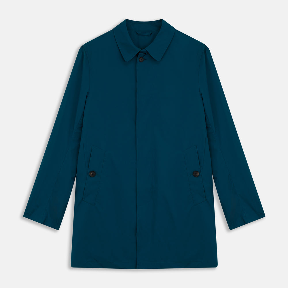 The Turnbull & Asser Blue Pack-Away Rain Mac is a knee-length coat with a classic collar, long sleeves, side buttoned pockets, and a concealed front placket, shown against a plain white background.