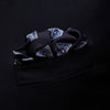 View 3 of product The Navy and Sky Blue Tiled Floral Silk Pocket Square by Turnbull & Asser features a geometric floral pattern in blue and white, a detailed border, and the brand's logo in the bottom right corner.