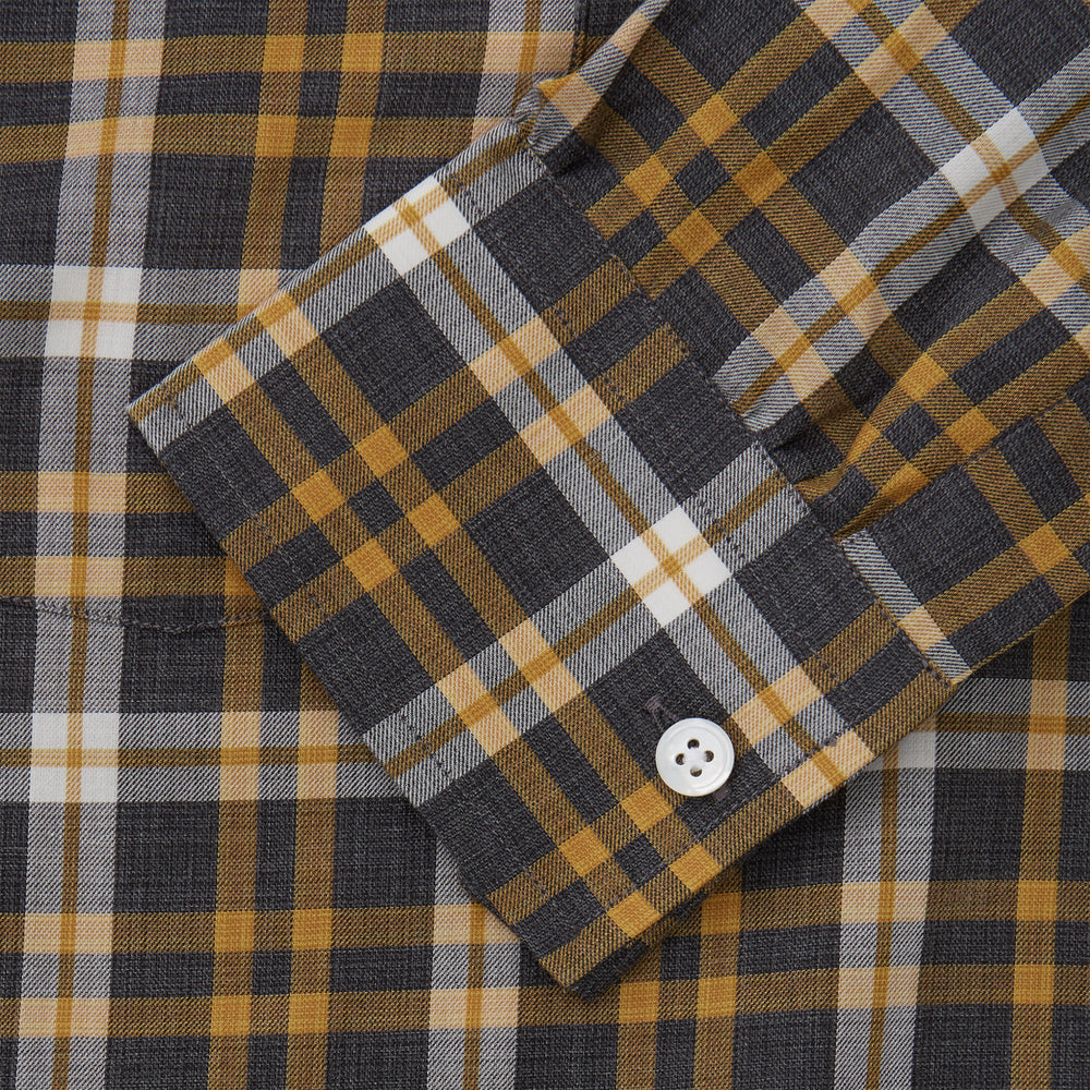 The Turnbull & Asser Yellow Check Weekend Fit Flannel Shirt features a Derby collar, 1-button cuffs, and a yellow, black, and white plaid pattern. It is shown laid flat on a white background.