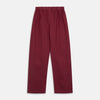 View 7 of product The Turnbull & Asser Burgundy Linen Modern Pyjama Set features a button-up, collared long-sleeve top with black piping and three pockets, plus matching pants with an elastic waistband.