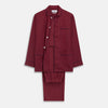 View 1 of product The Turnbull & Asser Burgundy Linen Modern Pyjama Set features a button-up, collared long-sleeve top with black piping and three pockets, plus matching pants with an elastic waistband.