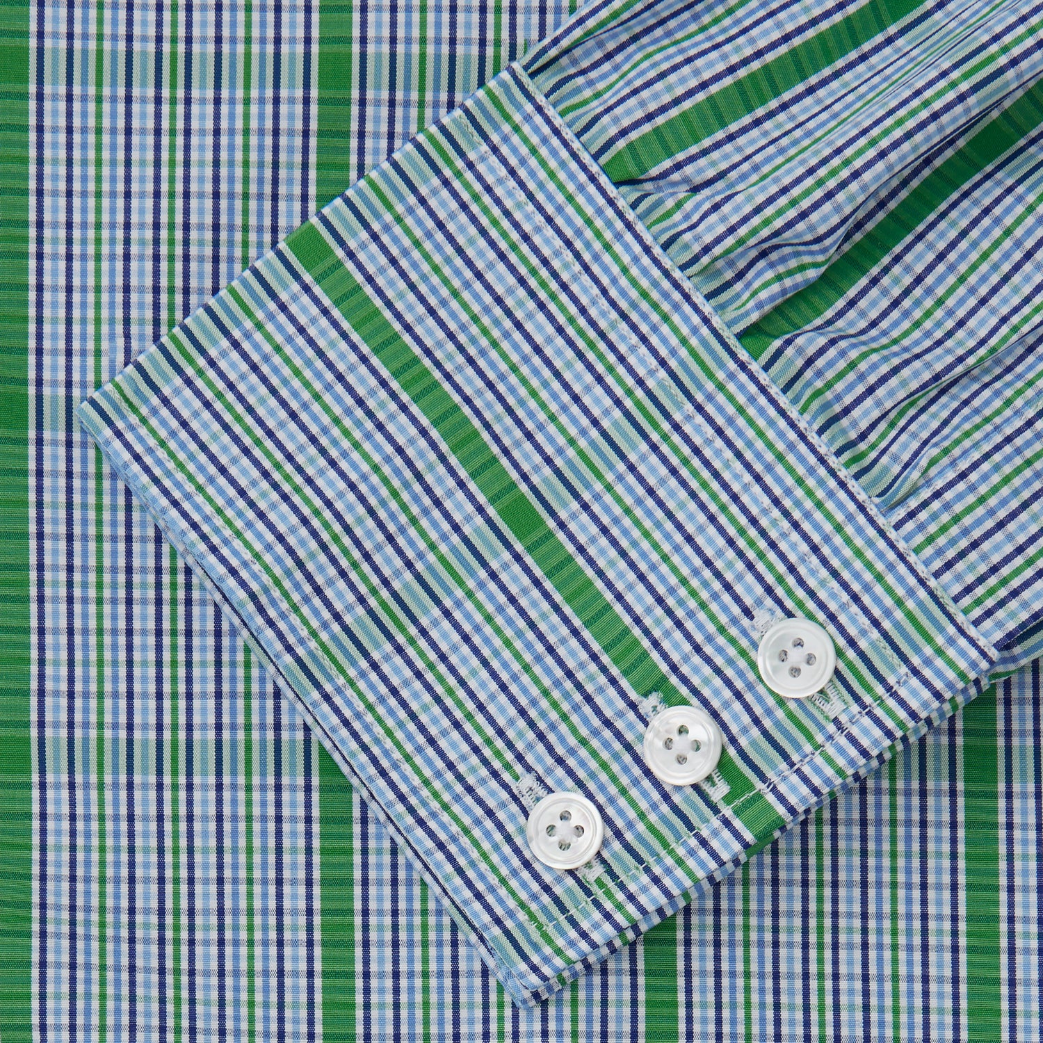 View 3 of product The Turnbull & Asser Green and Blue Fancy Check Regular Fit Shirt features a T&A collar and white buttons, displayed against a plain white background.