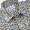 View 4 of product A man stands against a light background, wearing a Turnbull & Asser Yellow and Blue Fancy Check Regular Fit Shirt with T&A Collar, a patterned tie, dark dress pants, and black shoes. He faces forward with hands in pockets and a neutral expression.