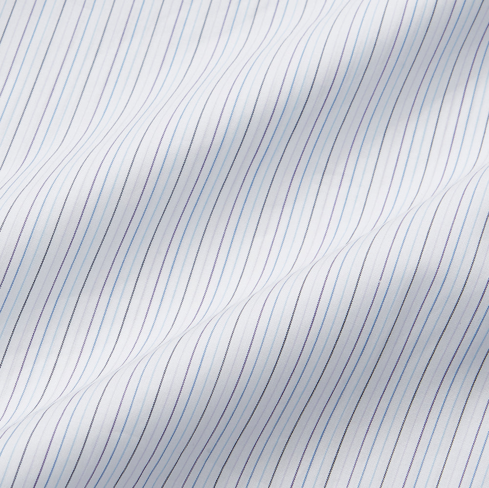 The Purple Multi Stripe Regular Fit Mayfair Shirt by Turnbull & Asser features long sleeves, a classic collar, and buttoned cuffs—perfect for achieving a refined yet relaxed style.