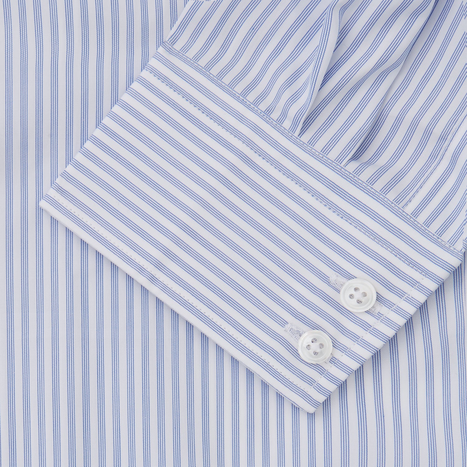View 3 of product The Turnbull & Asser Sky Blue and White Stripe Tailored Fit Shirt features a Kent collar, 2-button cuffs, and is crafted from fine Italian cotton, shown flat against a plain background.