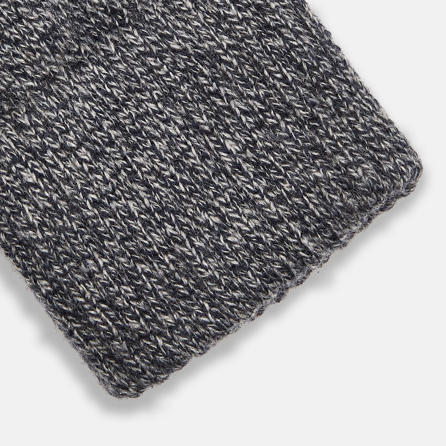 View 2 of product Turnbull & Asser Grey Cashmere Gloves are shown laid flat on a white background, with one glove slightly overlapping the other—a classic luxury accessory crafted in the spirit of Scottish knitwear.