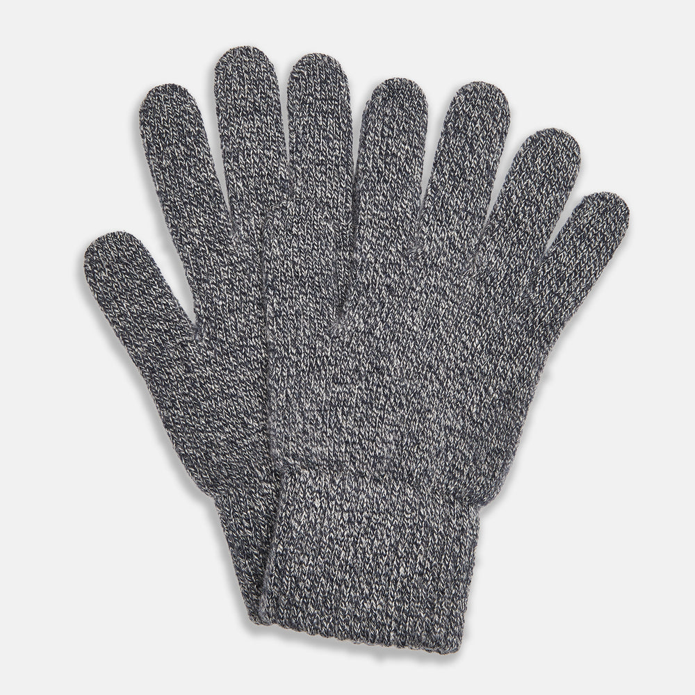 Turnbull & Asser Grey Cashmere Gloves are shown laid flat on a white background, with one glove slightly overlapping the other—a classic luxury accessory crafted in the spirit of Scottish knitwear.