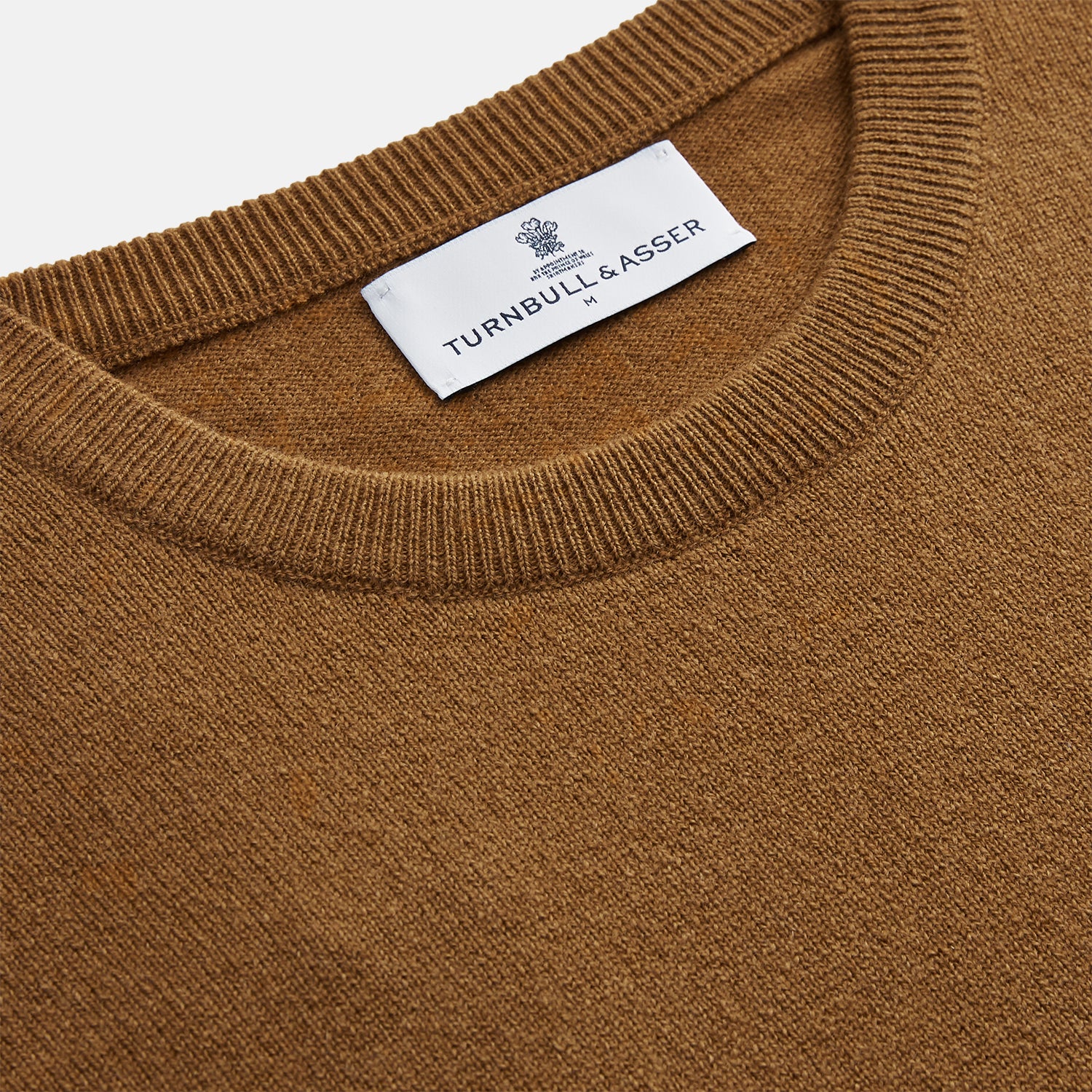View 2 of product The Vicuna Glenn Cashmere Crew Neck Jumper by Turnbull & Asser is a brown crew neck sweater with long sleeves, ribbed cuffs, hem, and neckline, displayed flat on a white background for a classic look.