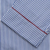 View 2 of product The Turnbull & Asser Navy & White Stripe Cotton Modern Pyjama Set features blue and white Bengal stripes with red piping, a long-sleeve button-up top, chest pocket, and matching pants. Shown laid flat on a white background.