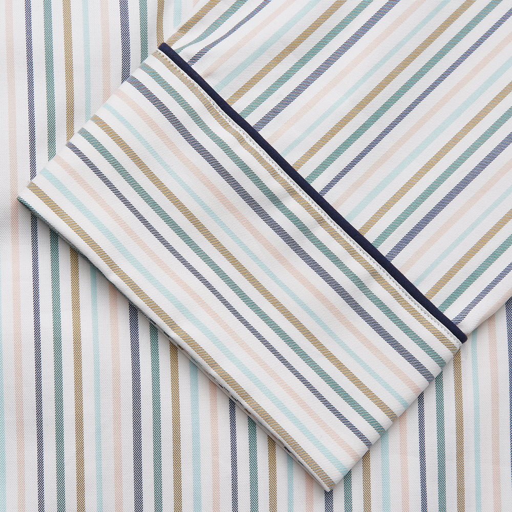 Turnbull & Asser’s Green Multi Stripe Harriet Women’s Pyjama Set features premium cotton, a button-up long-sleeve top, drawstring pants, and thin blue, green, and beige stripes on white with black piping for a timeless look.