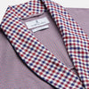 View 2 of product The Turnbull & Asser Burgundy Multi Check Contrast Cotton Gown features a long silhouette with a shawl collar, waist tie, and three pockets, accented by red, black, and white checkered trim—ideal for luxurious nights at home.
