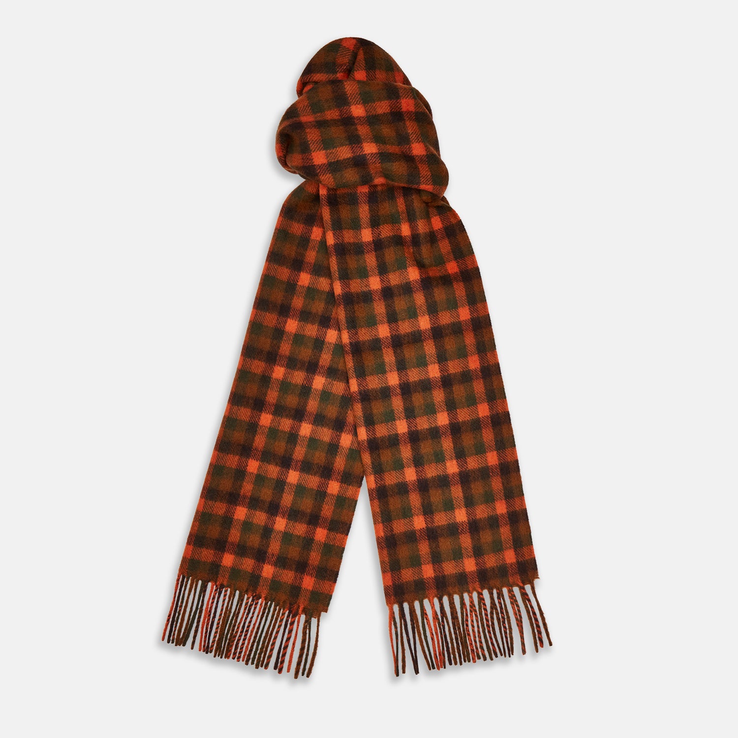 View 2 of product A man stands against a beige background wearing a navy long-sleeve shirt, brown pants, and a Turnbull & Asser Orange Multi Shepherd Check Cashmere Scarf draped around his neck. He faces forward with a neutral expression.