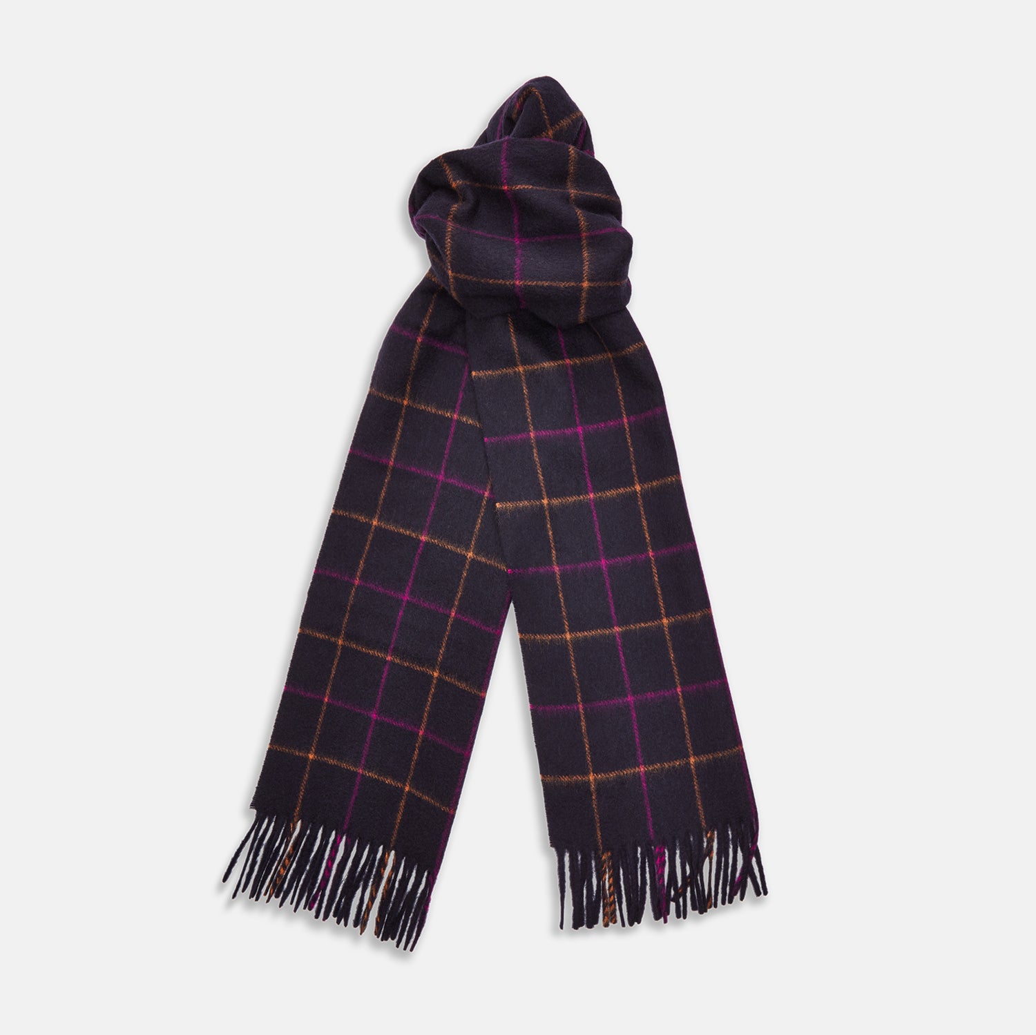 View 2 of product A man stands against a beige background wearing a rust sweater, dark pants, and a Turnbull & Asser Purple Multi Tattersall Check Cashmere Scarf, looking confidently at the camera with a neutral expression.