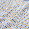 View 5 of product A man stands against a beige background, wearing a Turnbull & Asser Blue, Orange & Navy Multi Stripe Regular Fit Shirt with T&A collar and 3-button cuffs, tucked into tan dress pants with a black belt. He faces forward with a neutral expression.