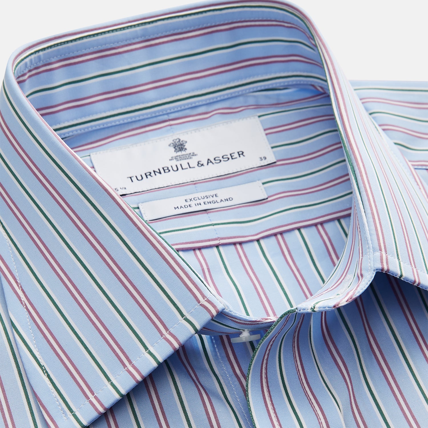 View 2 of product The Turnbull & Asser Blue, Purple & Green Stripe Regular Fit Shirt features a T&A collar and 3 button cuffs, laid flat on a white surface.