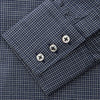 View 5 of product A man in a tie wears the Turnbull & Asser Navy Check Regular Fit Flannel Shirt with T&A collar and 3 button cuffs.