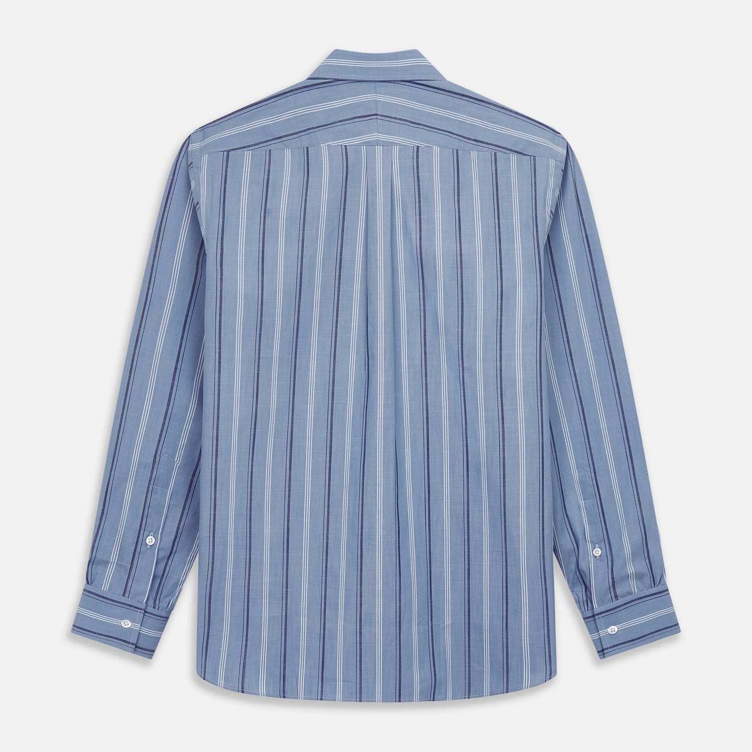 View 6 of product A man stands against a plain tan background wearing Turnbull & Asser's Blue Multi Chambray Stripe Weekend Fit Shirt with a Derby collar and 1 button cuffs, paired with a red patterned tie and gray trousers. His hands are in his pockets.