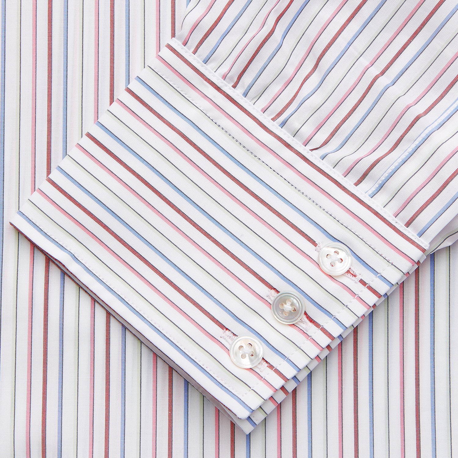 View 2 of product The Turnbull & Asser Red Multi Blazer Stripe Mayfair Shirt features a regular fit, thin red and blue stripes on white, buttoned cuffs, a T&A collar, and classic formal styling.