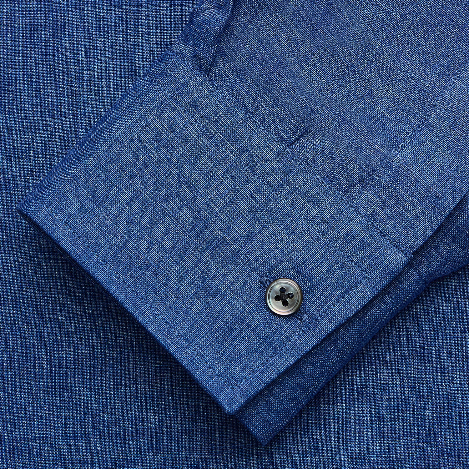 View 3 of product The Turnbull & Asser Navy Linen Weekend Fit Blake Shirt features long sleeves and a stand collar, shown here laid flat on a white background.
