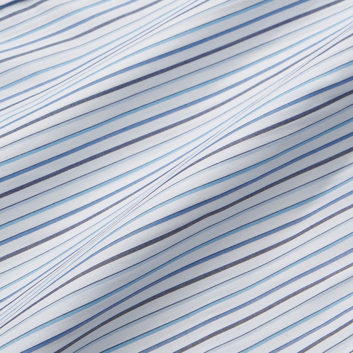 View 3 of product The Turnbull & Asser Blue Multi Blazer Stripe Weekend Fit Suffolk Shirt is a long-sleeved, collared button-up with vertical blue stripes and a chest pocket, shown laid flat on a white background—ideal for casual weekends.