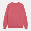 View 3 of product The Turnbull & Asser Pink Cashmere Glenn Jumper is a solid pink, long-sleeved menswear sweater with a crewneck, shown laid flat on a white background.