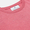 View 2 of product The Turnbull & Asser Pink Cashmere Glenn Jumper is a solid pink, long-sleeved menswear sweater with a crewneck, shown laid flat on a white background.