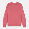 View 3 of product The Pink Cashmere Paden V-Neck Jumper by Turnbull & Asser, knitted in Scotland, is shown laid flat on a white background. This long-sleeved sweater features ribbed cuffs, hem, and neckline.