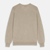 View 3 of product The Turnbull & Asser Beige Cashmere Paden V-Neck Jumper is laid flat on a white background. Knitted in Scotland, this men's staple features ribbed cuffs, hem, and neckline with a soft, smooth texture.