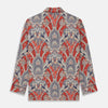 View 6 of product The Turnbull & Asser Red Baroque Silk-Blend Hyde Pyjama Set features a long-sleeve button-up shirt and matching pants in an intricate red, blue, and beige floral-geometric print, displayed flat against a white background.