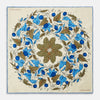 View 1 of product The Turnbull & Asser Pale Blue and Oat Foliage Pattern Silk Pocket Square is crafted in England, featuring a cream background with a circular blue and green floral design, bordered edges, and the brand's logo in one corner.