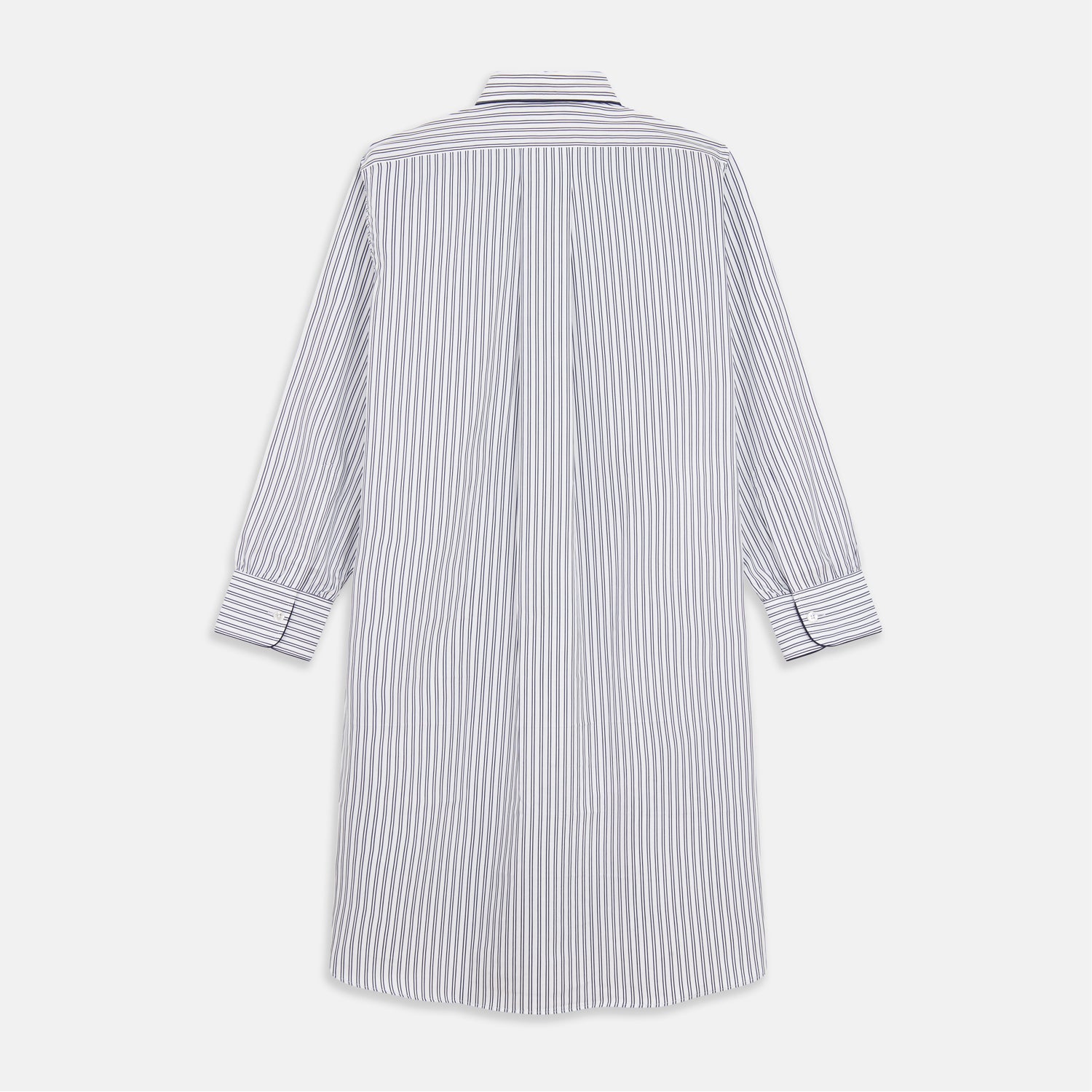 View 5 of product The Turnbull & Asser White and Navy Striped Cotton Sussex Nightshirt features long sleeves, a knee-length cut, a collar, front buttons, a chest pocket with dark trim, and a curved hem for modern comfort inspired by tradition.