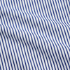 View 4 of product The Turnbull & Asser Navy Stripe Cotton Regular Fit Whitby Shirt features vertical blue and white stripes, long sleeves, a collar, double cuffs, and a button-down front, shown laid flat on a white background.