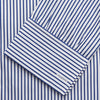 View 3 of product The Turnbull & Asser Navy Stripe Cotton Regular Fit Whitby Shirt features vertical blue and white stripes, long sleeves, a collar, double cuffs, and a button-down front, shown laid flat on a white background.