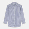 View 1 of product The Turnbull & Asser Navy Stripe Cotton Regular Fit Whitby Shirt features vertical blue and white stripes, long sleeves, a collar, double cuffs, and a button-down front, shown laid flat on a white background.