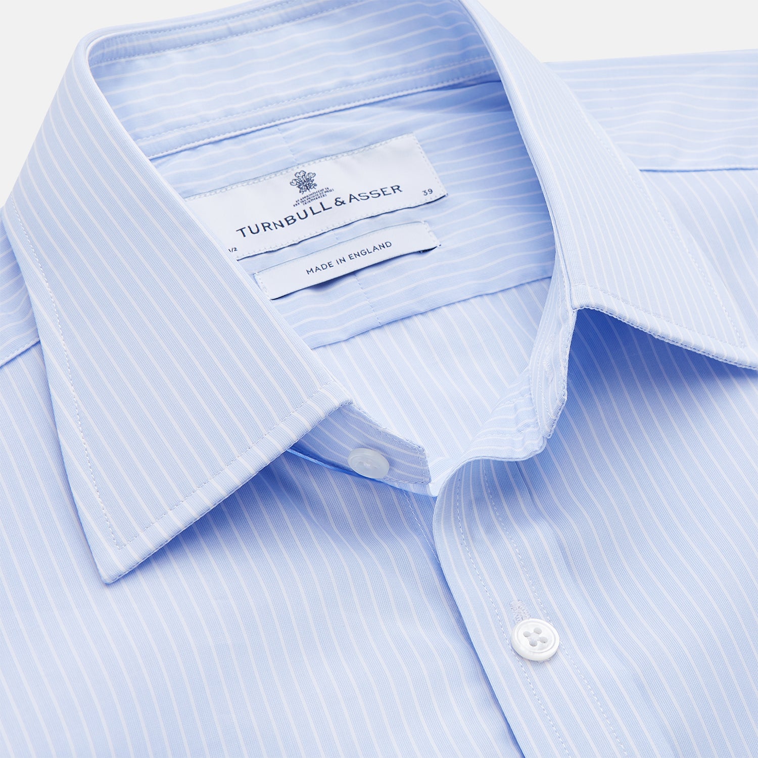View 2 of product The Light Blue Multi-stripe Cotton Regular Fit Mayfair Shirt by Turnbull & Asser features a T&A collar, button-down front, and buttoned cuffs, displayed flat against a white background.