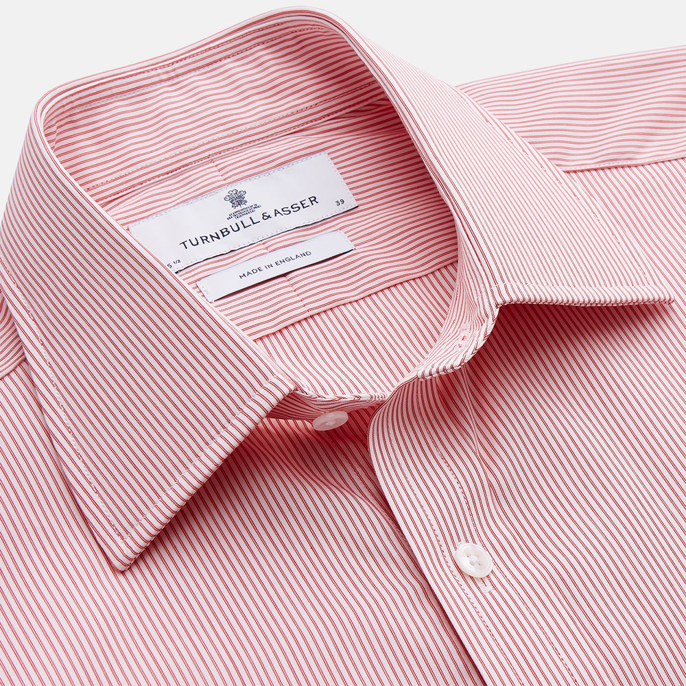 The Turnbull & Asser Pink and White Stripe Cotton Regular Fit Mayfair Shirt features a T&A collar, long sleeves, and white buttons, shown against a plain white background.