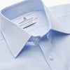 View 3 of product The Light Blue Multi-Check Cotton Regular Fit Mayfair Shirt by Turnbull & Asser is shown laid flat, featuring a classic T&A collar, front buttons, and buttoned cuffs on a white background.