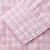 View 3 of product The Turnbull & Asser Pink Multi-check Cotton Regular Fit Mayfair Shirt features long sleeves, a T&A collar, buttoned cuffs, and a light pink check pattern, shown against a plain white background.