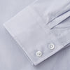 View 3 of product The Turnbull & Asser Faded Blue Block Check Cotton Shelton Shirt features a tailored fit, long sleeves, button-down front, and classic collar, displayed flat on a white background.