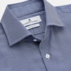 View 2 of product The Turnbull & Asser Navy Pattern Cotton Voile Tailored Fit Shelton Shirt is laid flat, showcasing its classic collar and white front and cuff buttons.
