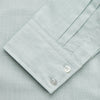 View 3 of product The Turnbull & Asser Light Green Chambray Tailored Fit Shelton Shirt features long sleeves, a classic collar, and white buttons—an elegant men's formal shirt shown neatly laid flat on a white background.